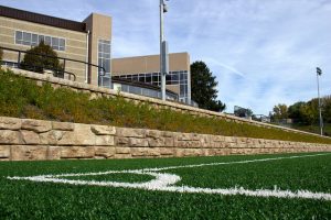 Retaining wall along synthetic turf field at Seven Hills School